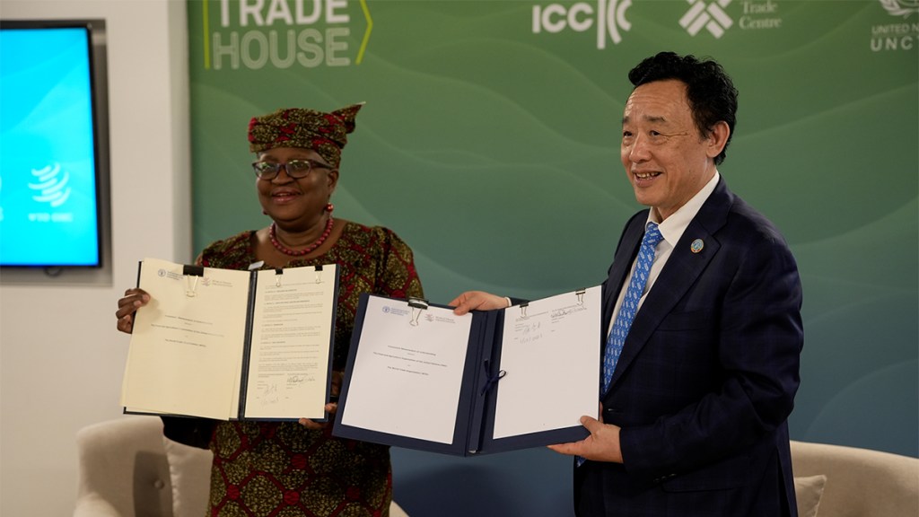 WTO and FAO representatives sign MOU on trade, food, and climate. 